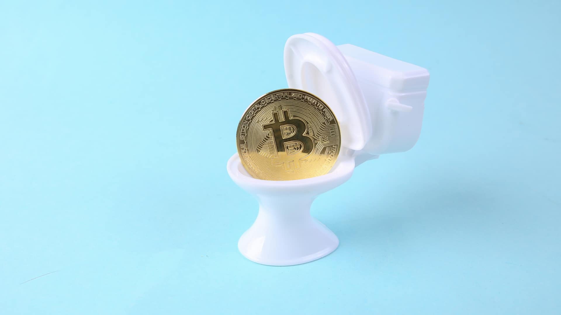 Bitcoin dentro de vaso sanitário criptomoeda fezes humanas