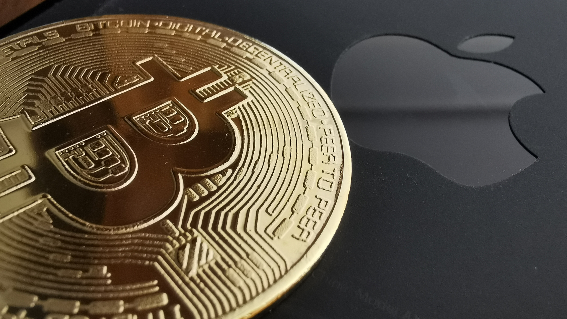 Bitcoin e símbolo da Apple criptomoedas