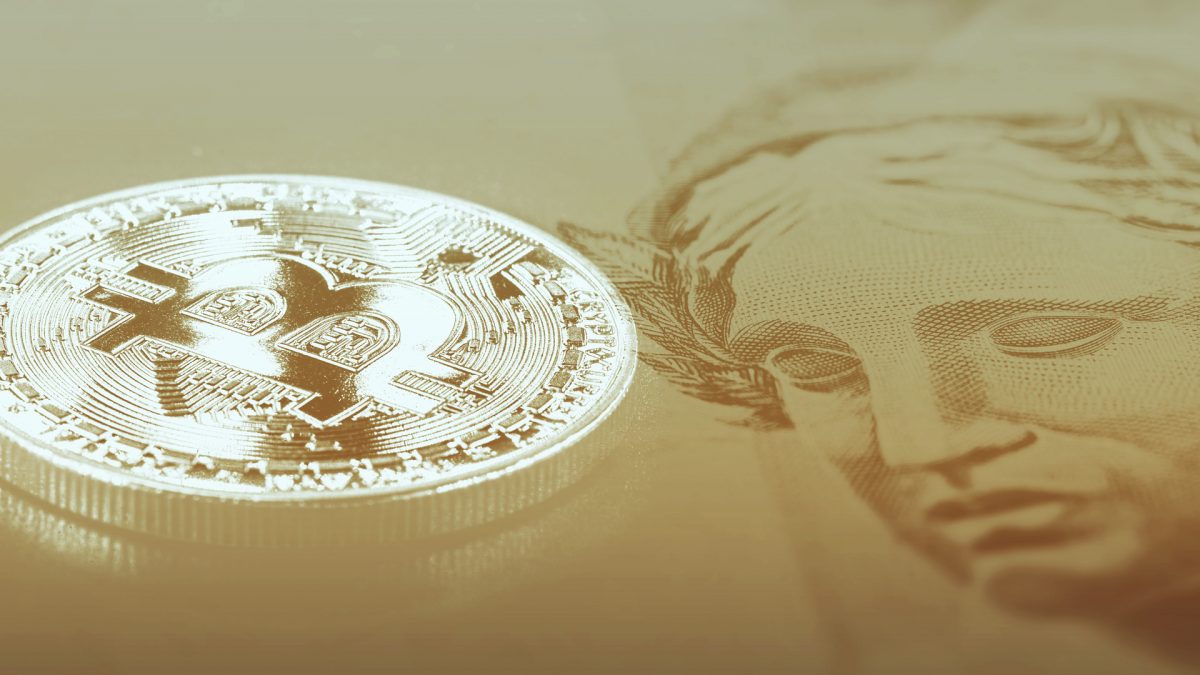 Moeda Bitcoin e Cédula de Real