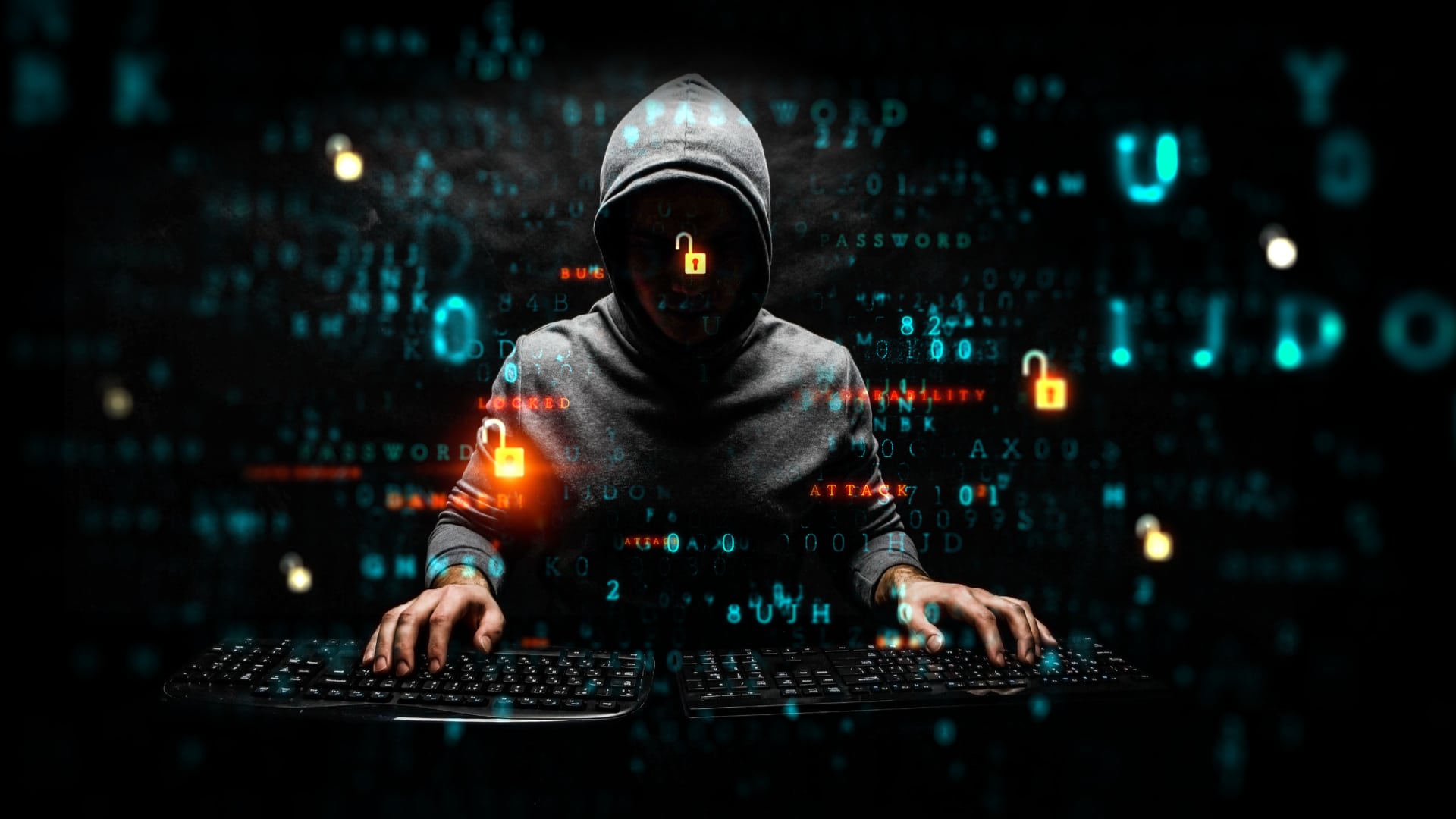 Hacker usando dois teclados.