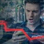 Investidor desapontado com queda em cotação em corretoras, gráficos de preços