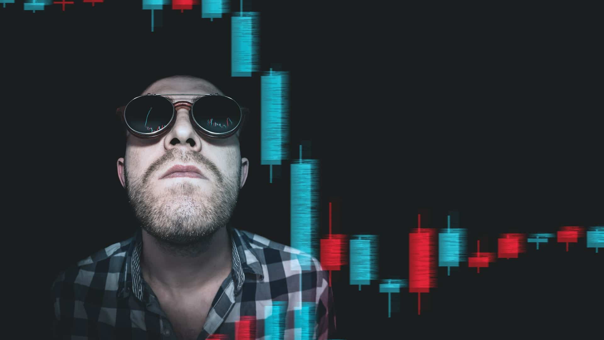 Trader de bitcoin olhando gráficos em queda