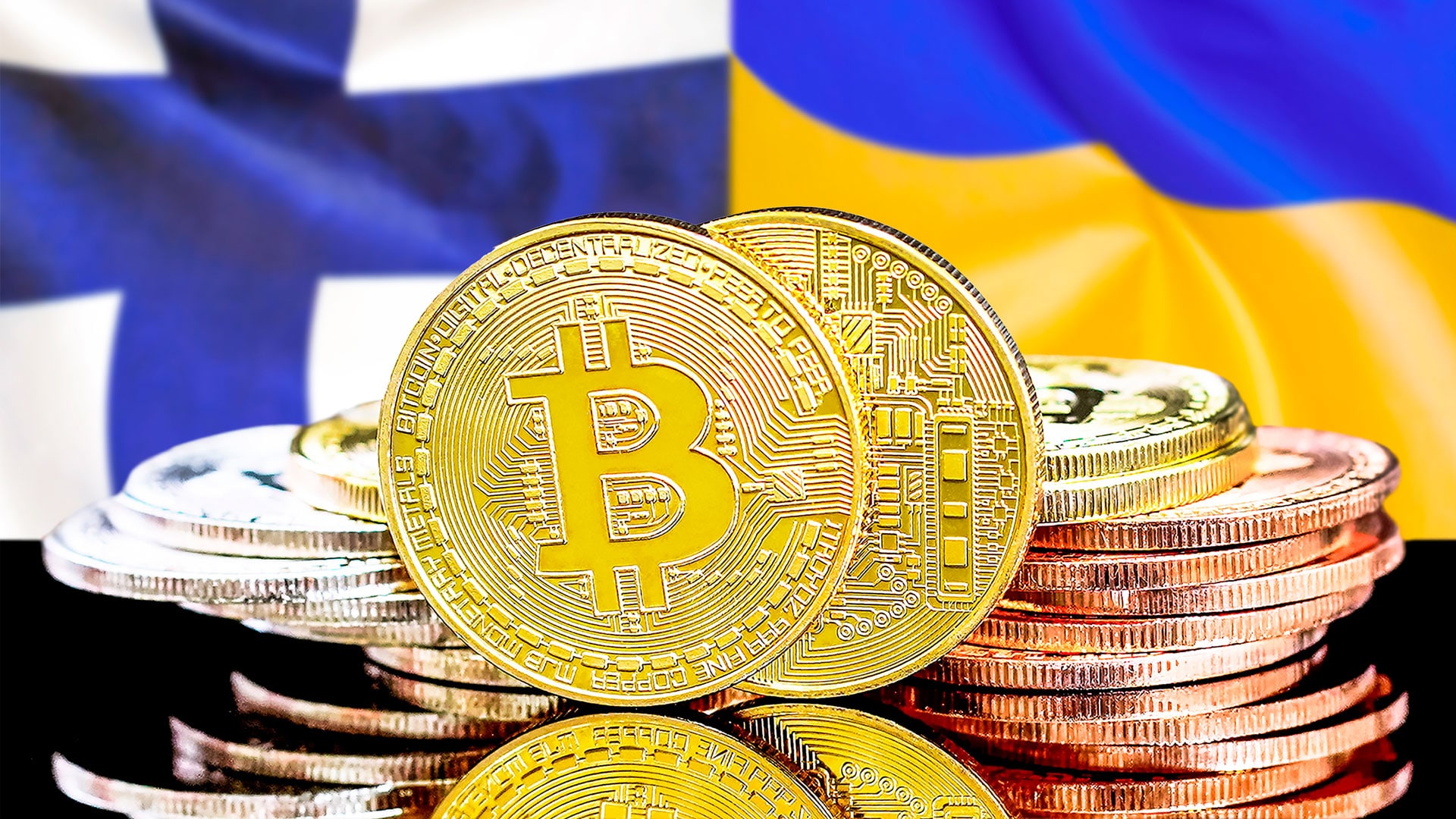 Bandeiras da Finlândia e Ucrânia com moedas de Bitcoin à frente.