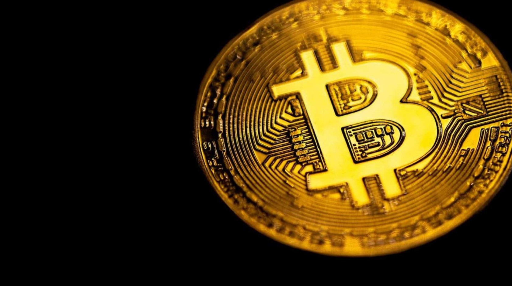 Moeda de Bitcoin em destaque.